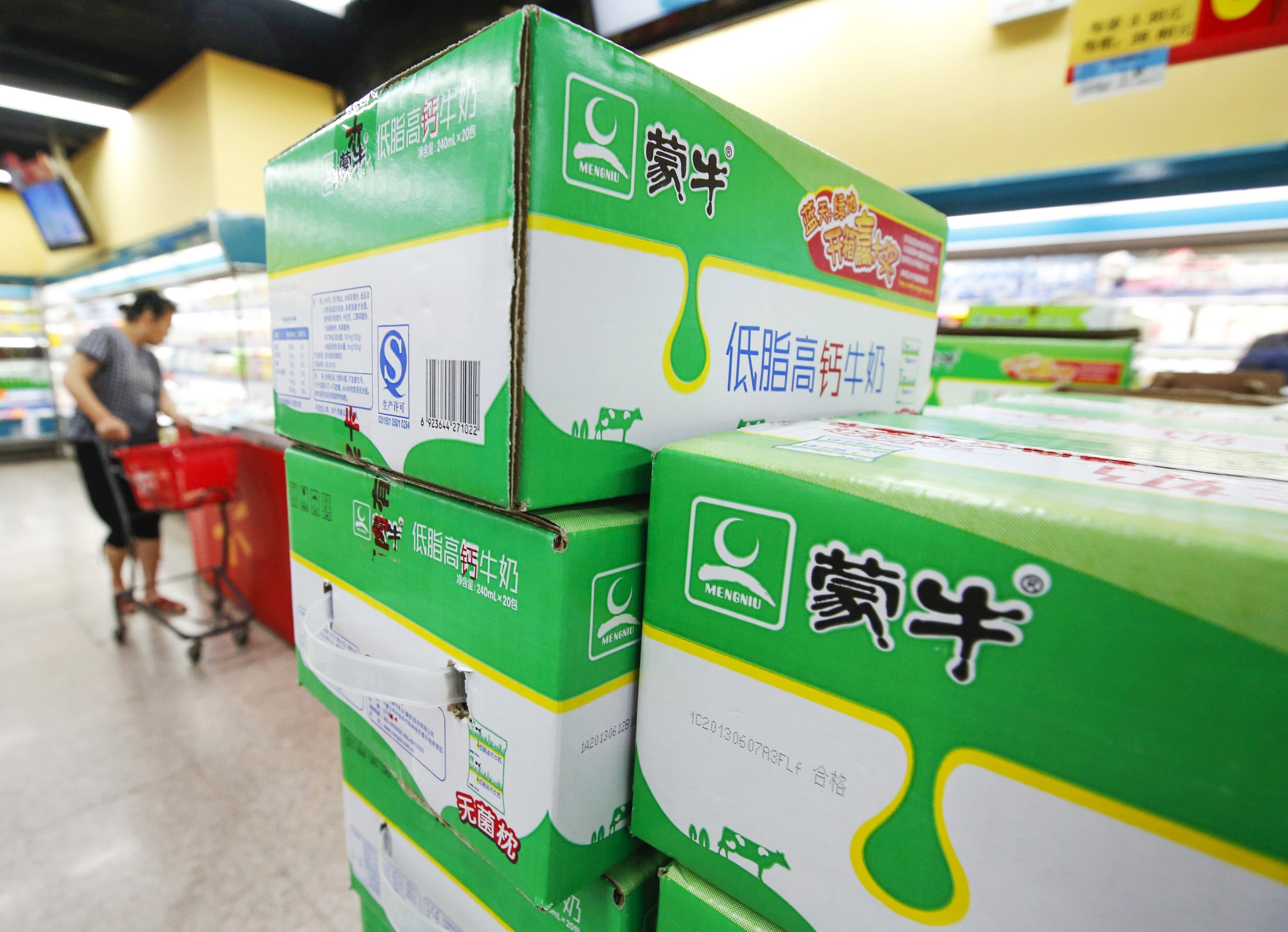 Boxes of Mengniu's milk products are seen at a supermarket in Beijing. Photo: Reuters