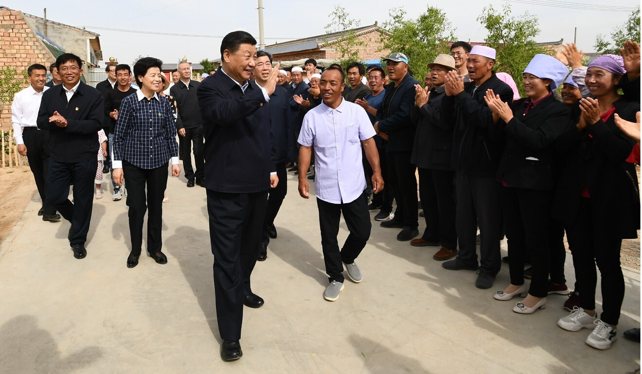 President Xi Jinping visits the village of Hongde in Wuzhong on Monday. Photo: Xinhua