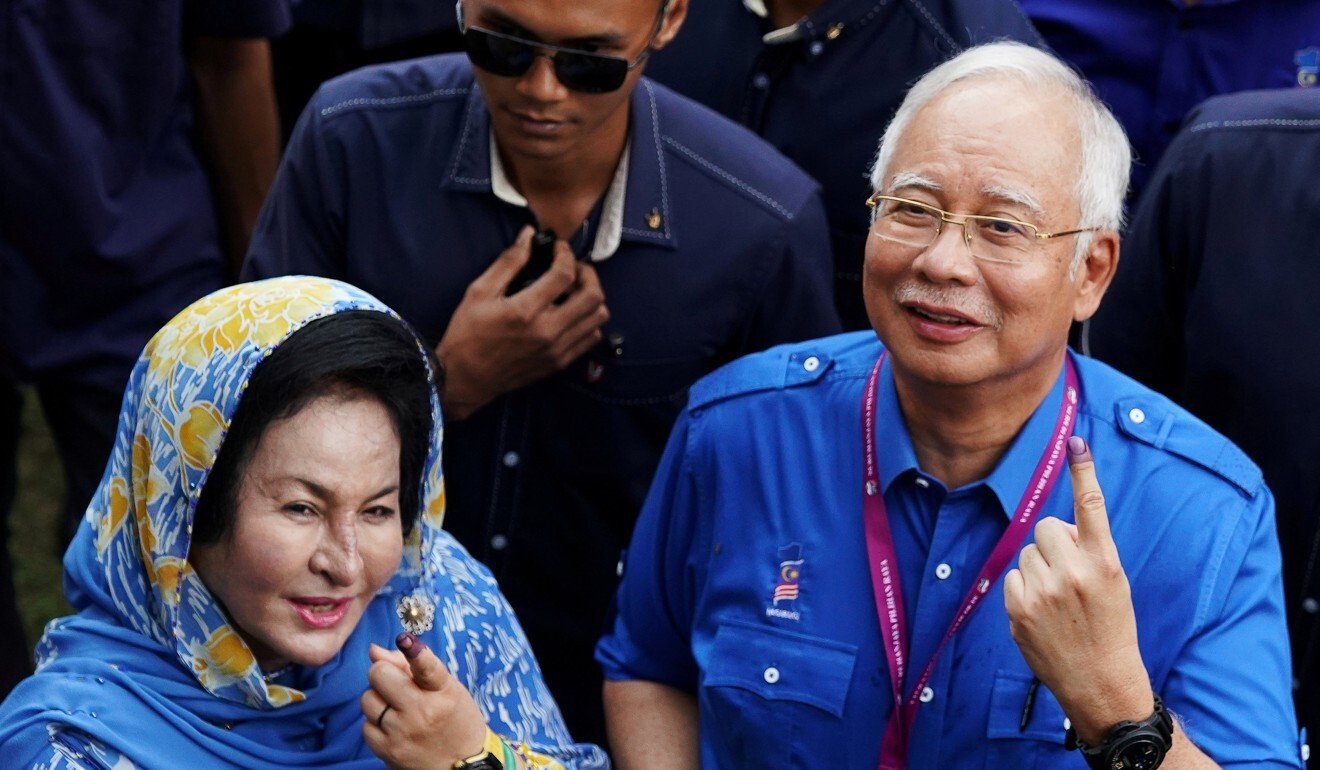 Rosmah Mansor and Najib Razak after voting in the 2018 election. Photo: Reuters