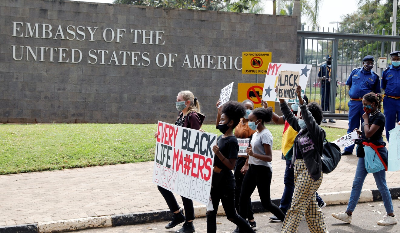 Demonstrators bearing placards march past the US embassy in Nairobi on Tuesday. Photo: Reuters