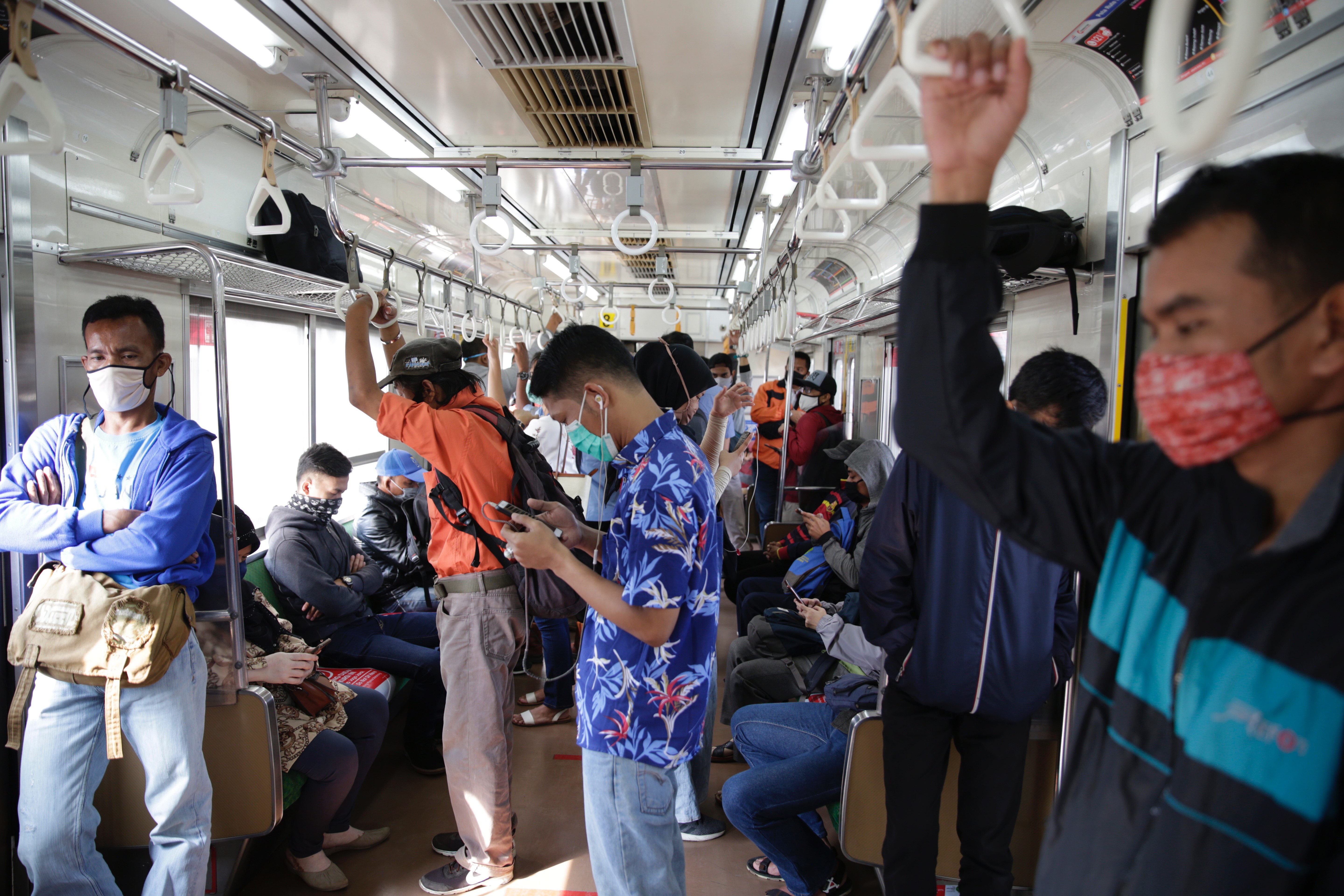 Passengers pictured on a commuter-line train in Bogor, Indonesia, on June 10. Photo: EPA