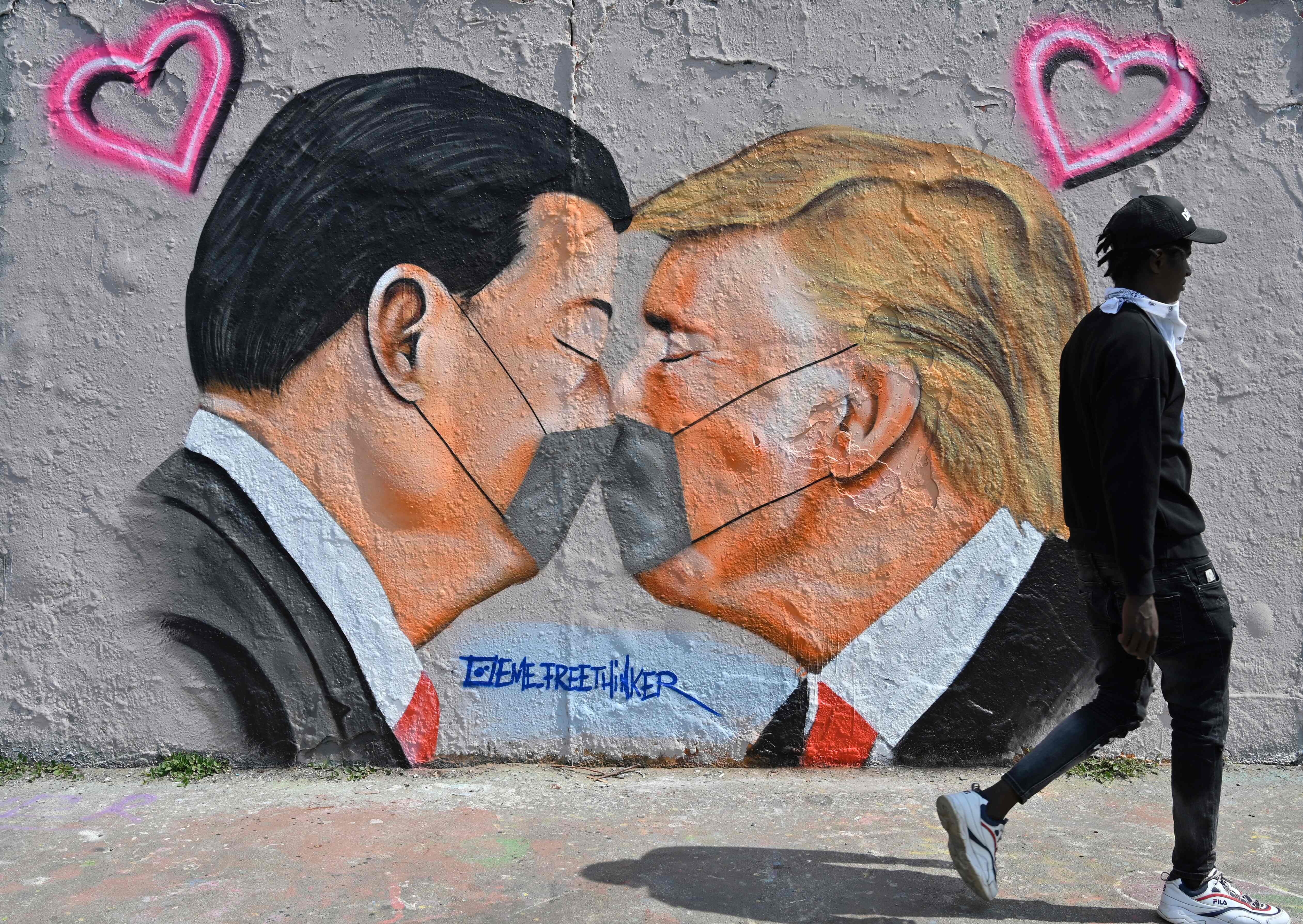 A mural in Berlin of Presidents Xi Jinping and Donald Trump. No matter how they view one another, Washington and Beijing need each other to shore up the global economic outlook and foster a recovery. Photo: AFP