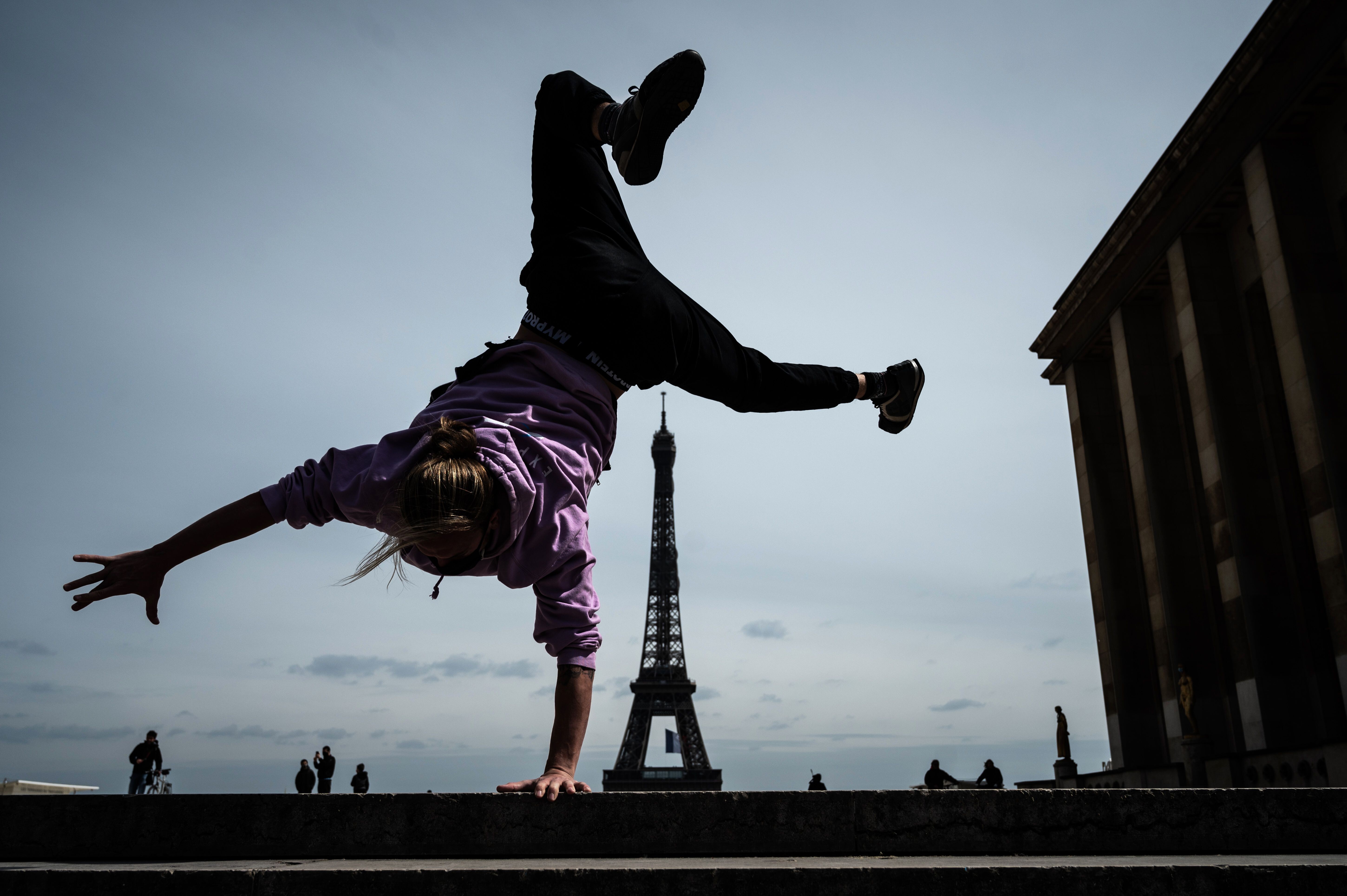 French freerunner Johan Tonnoir practises on Trocadero Plaza with the Eiffel Tower in the background in Paris on May 11, the first day of France’s easing of lockdown measures that had been in place for 55 days to curb the spread of Covid-19. Photo: AFP