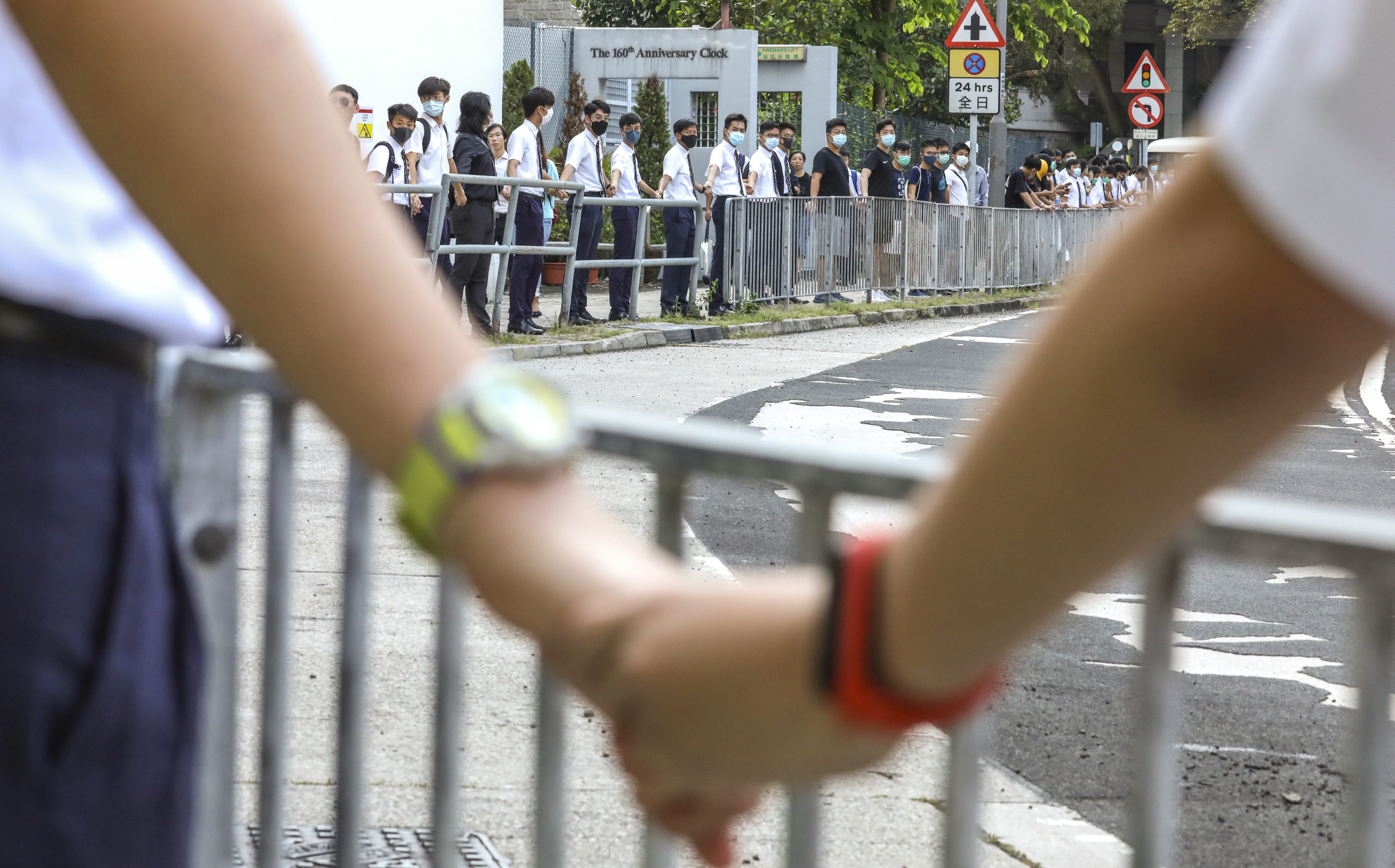 Pupils from schools in Mid-Levels form a human chain as part of last year’s anti-government protests. Photo: Nora Tam