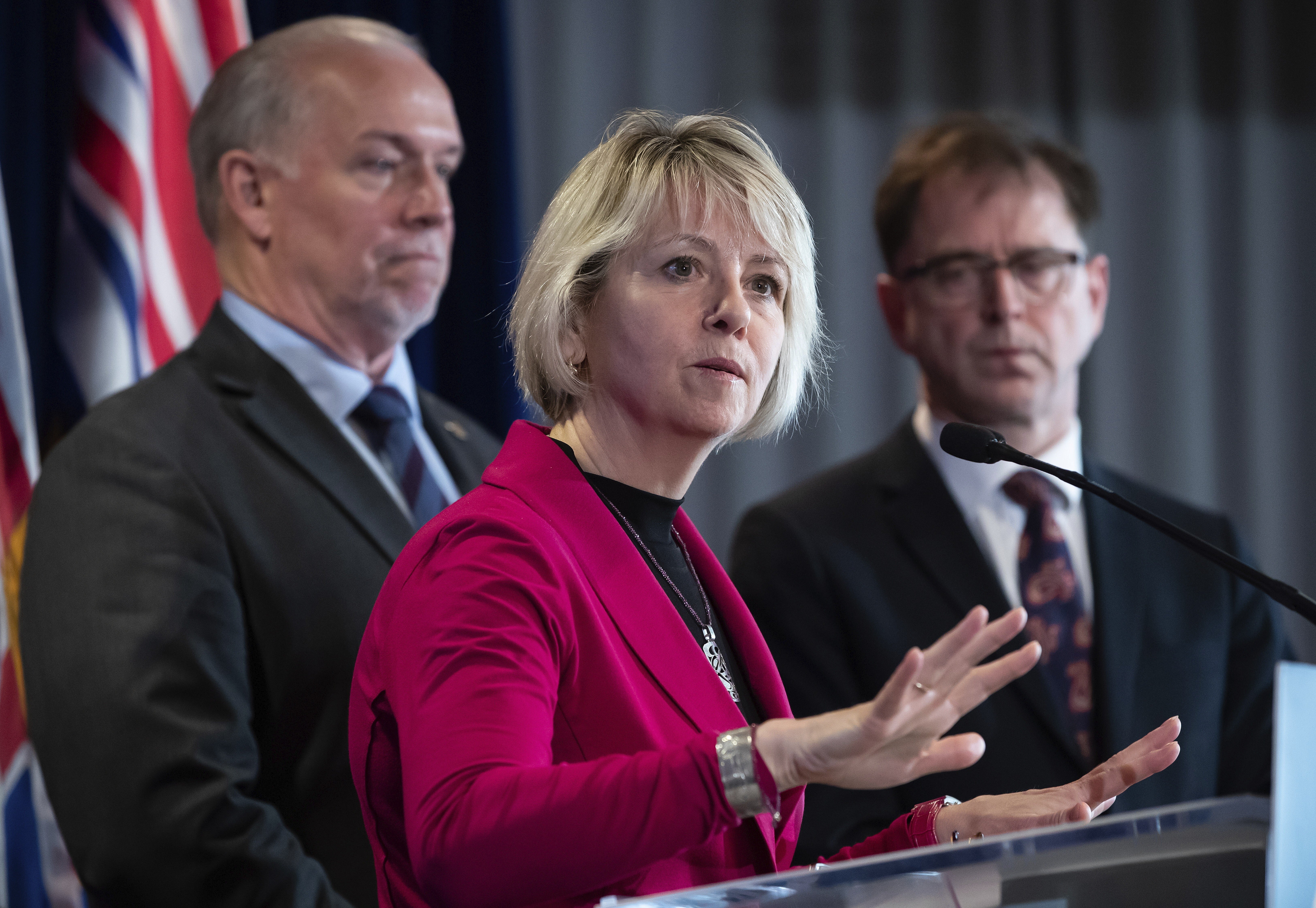 British Columbia provincial health officer Dr Bonnie Henry responds to questions while British Columbia Premier John Horgan (left) and Health Minister Adrian Dix listen during a news conference in March. Photo: AP