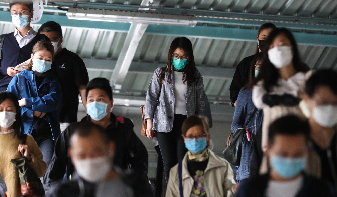 Commuters in face masks. Photo: Winson Wong