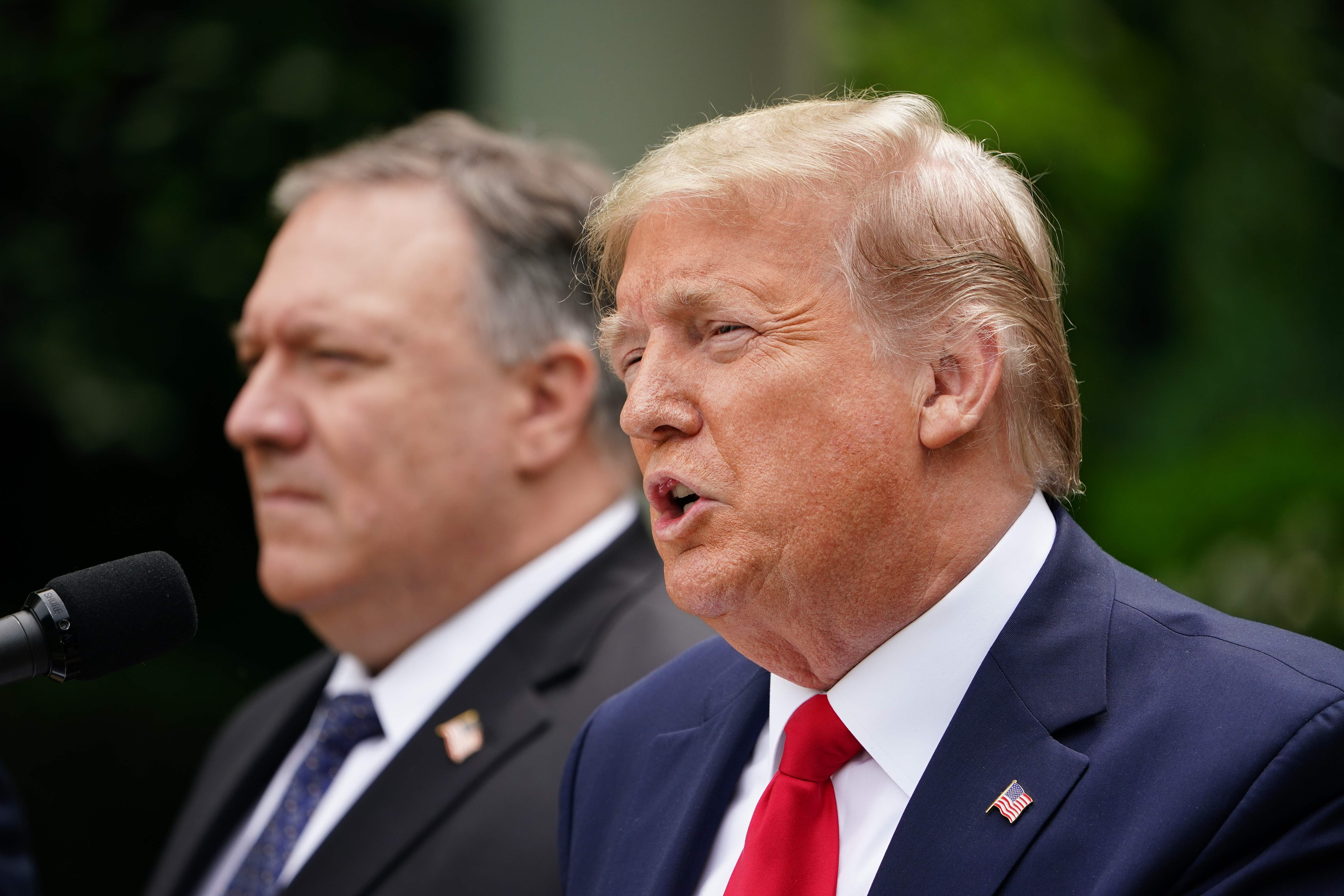 US President Donald Trump speaks at a press conference on China as Secretary of State Mike Pompeo listens in the Rose Garden of the White House on May 29. Photo: AFP