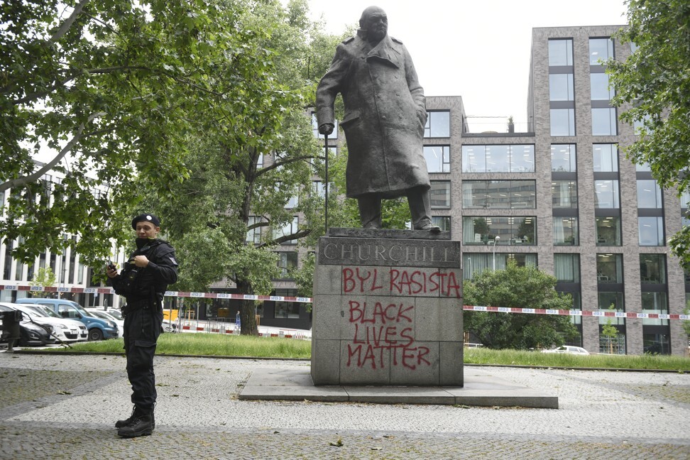 Statues of colonial figures, including Winston…