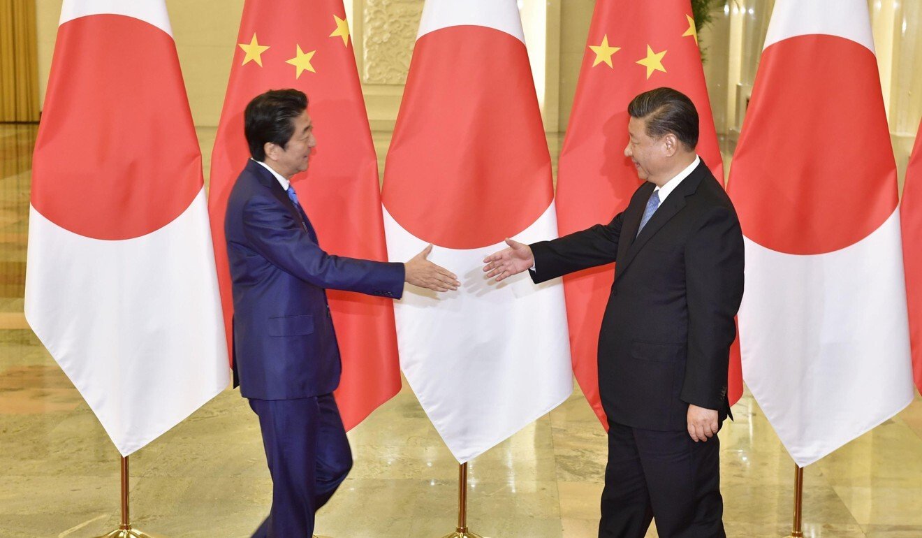 Xi Jinping welcomes Shinzo Abe to Beijing in December. Photo: Kyodo