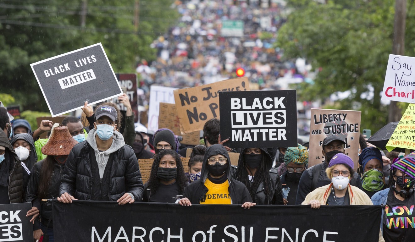 People take part in a silent march through Seattle’s Central District on June 12, 2020. Photo: Zuma Wire/dpa