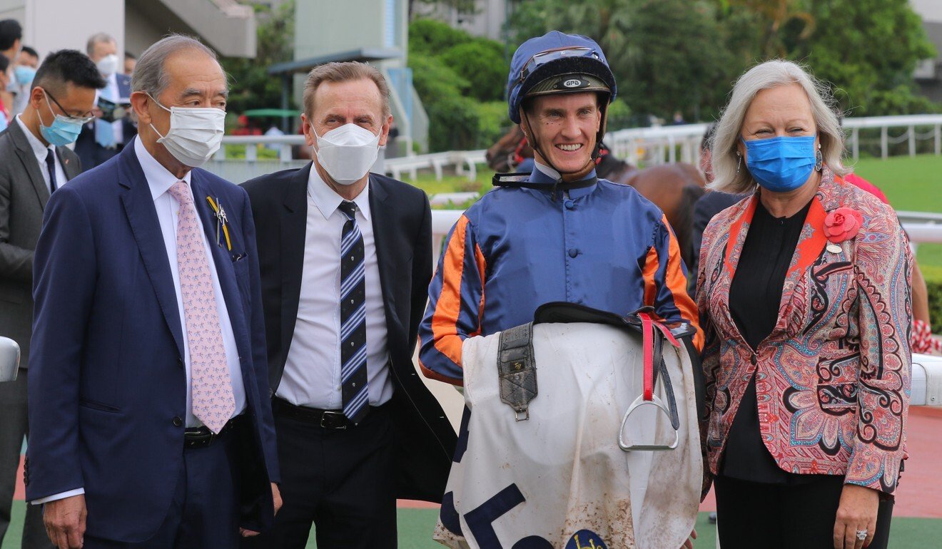 Ronald Arculli with trainer John Size, jockey Chad Schofield and wife Johanna after Red Desert’s win at Sha Tin.