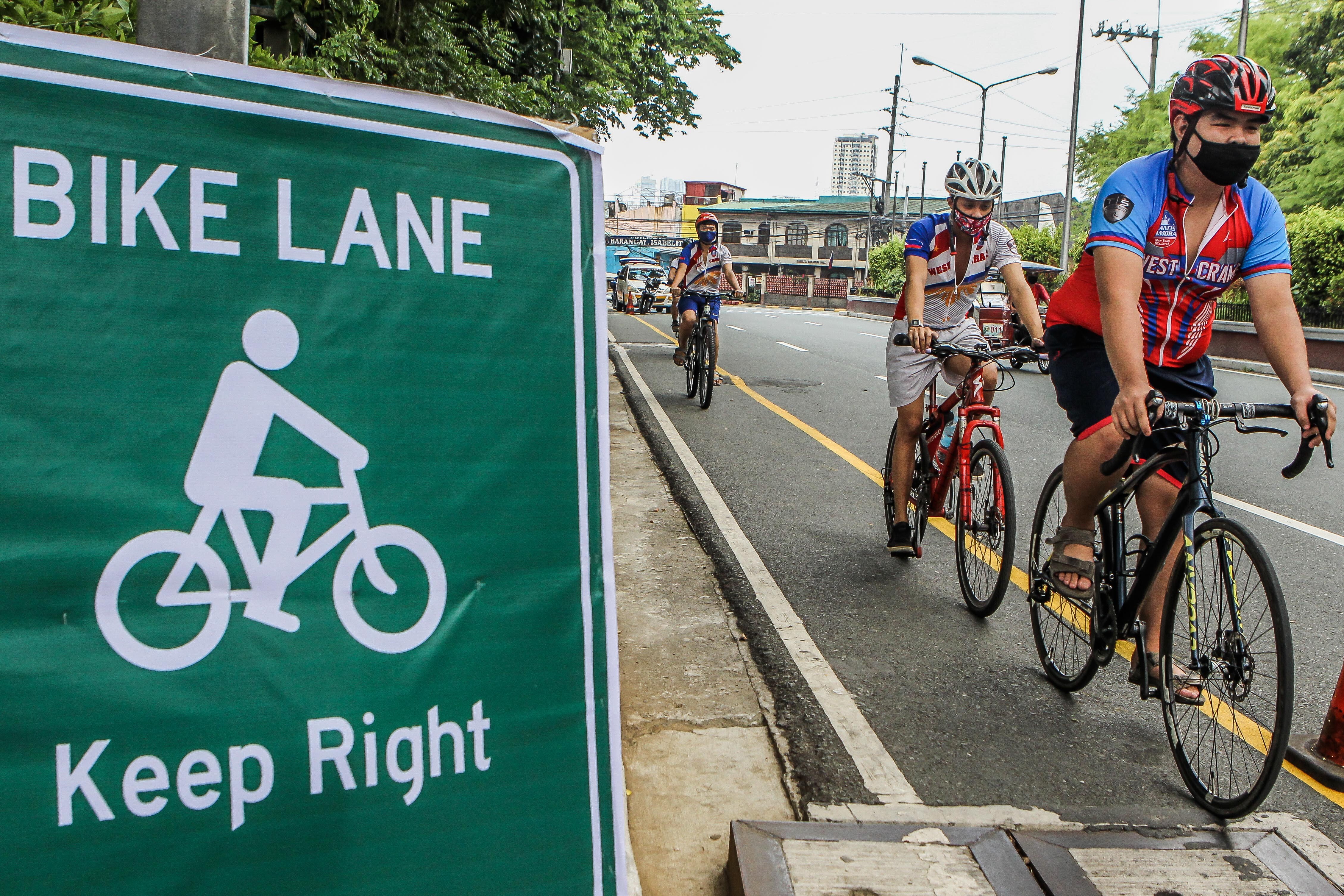 People ride their bicycles along a newly-installed bike lane in Manila. The coronavirus pandemic and shutdown of public transport during lockdown has renewed interest in cycling as a viable and sustainable transport option. Photo: Xinhua