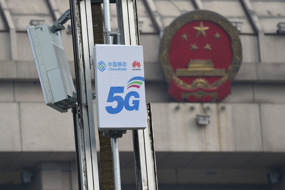 5G base stations with logos of China Mobile and Huawei Technologies are seen in February of last year. Photo: Reuters