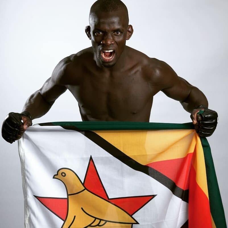 Themba Gorimbo shows off the Zimbabwe flag. Photo: Instagram