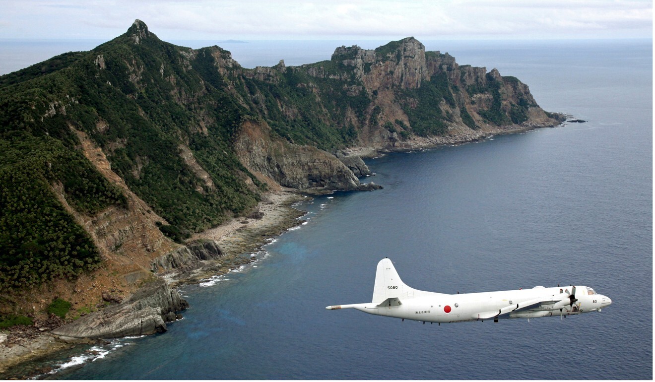 A Japan Maritime Self-Defence Force surveillance plane flies over the disputed islands, called the Senkaku in Japan and Diaoyu in China. File Photo: Kyodo
