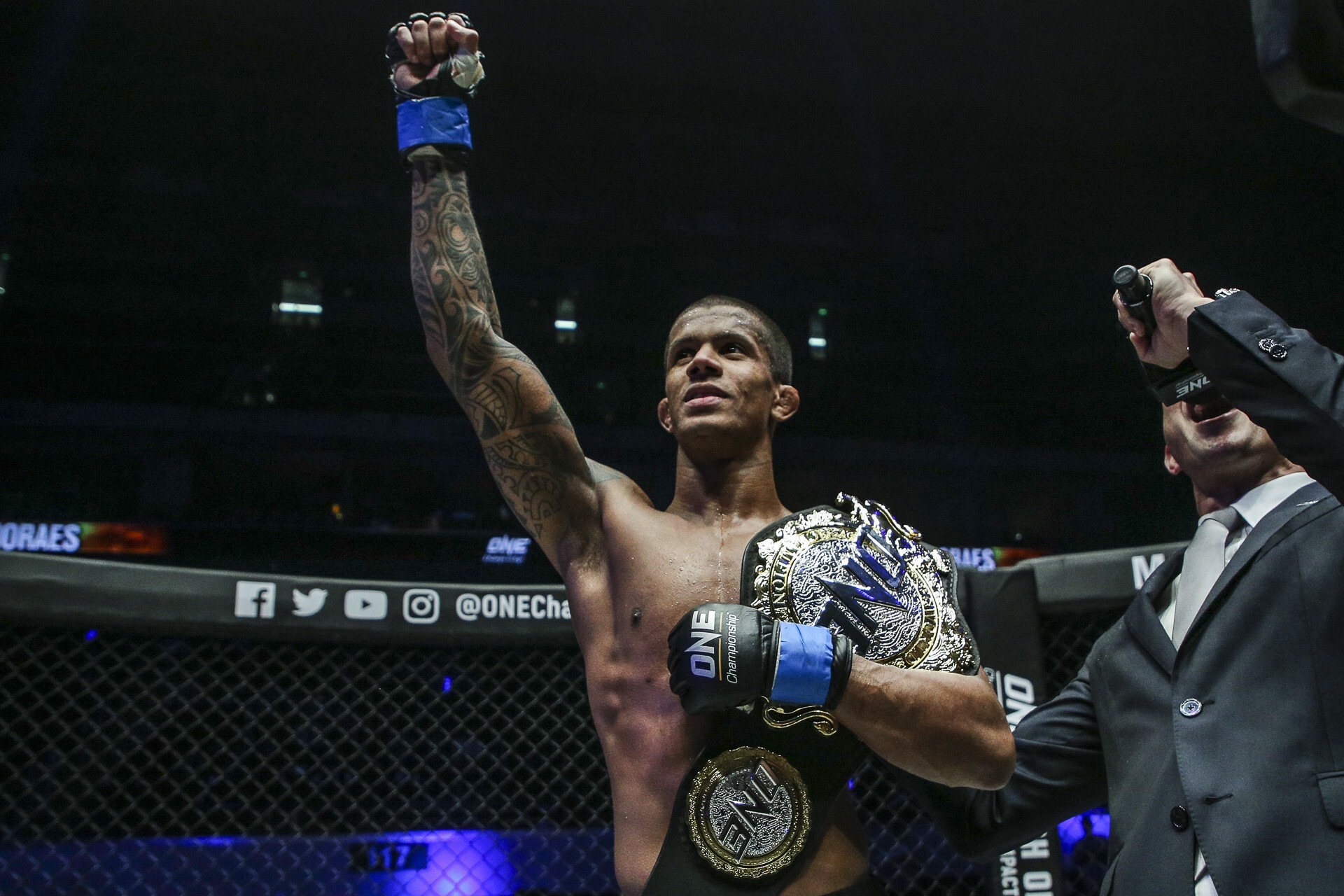 Adriano Moraes with his ONE flyweight title. Photos: ONE Championship