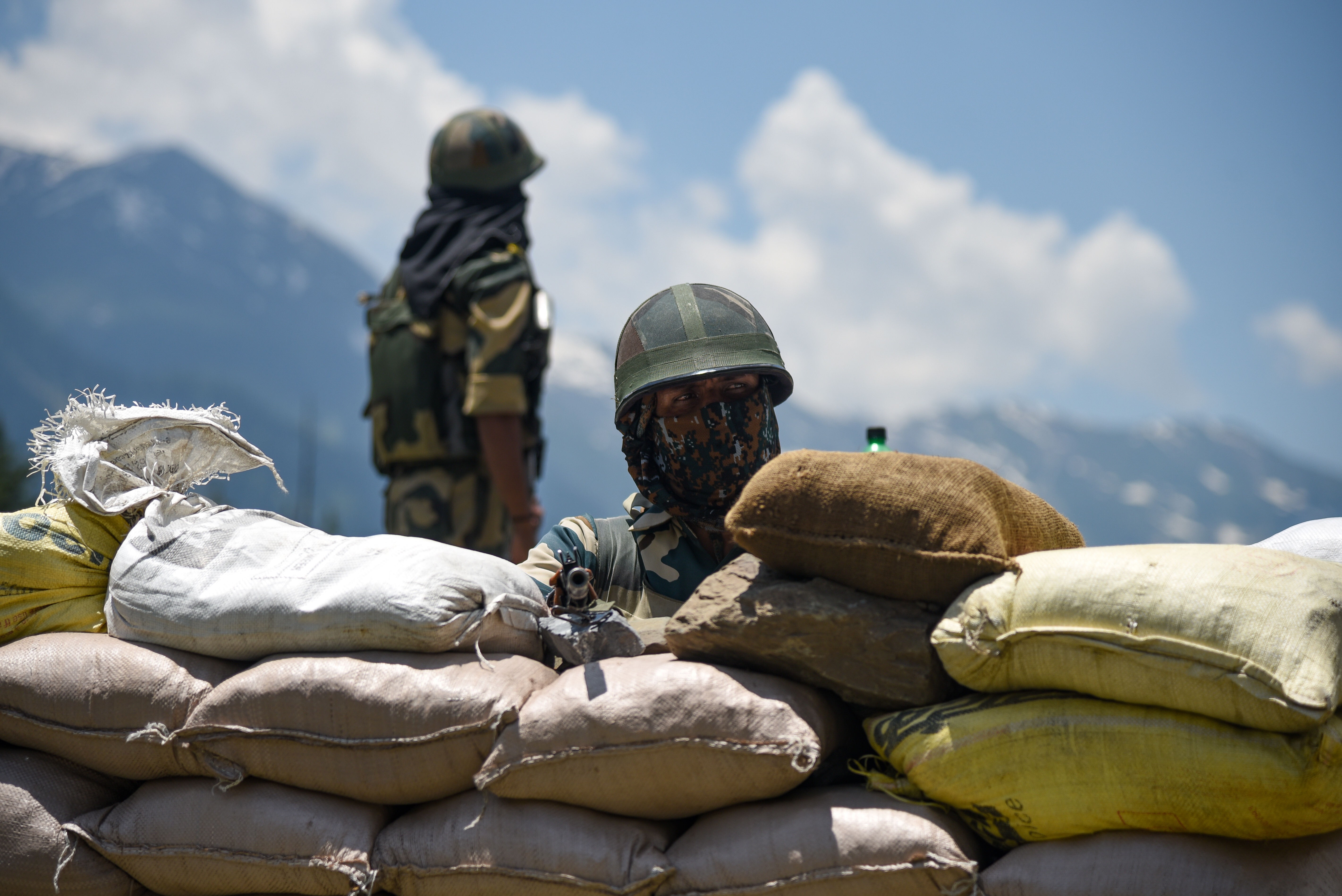 Indian soldiers guard a highway leading to the Ladakh region. Photo: DPA