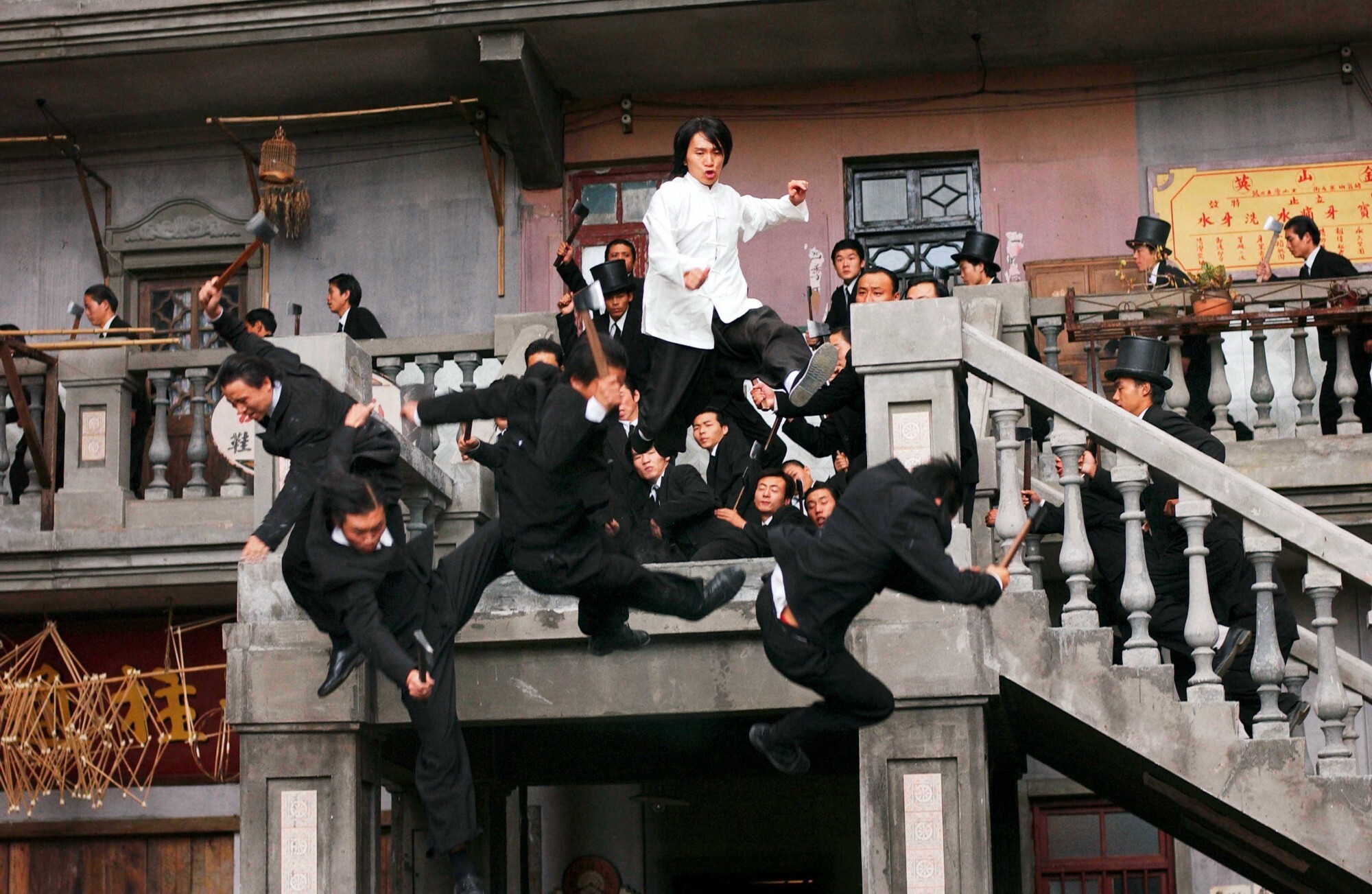 Stephen Chow (in white shirt) in a still from Kung Fu Hustle, the 2004 film that made him an international star. He also wrote and directed the film, a blend of cartoons, wuxia, CGI, and action.
