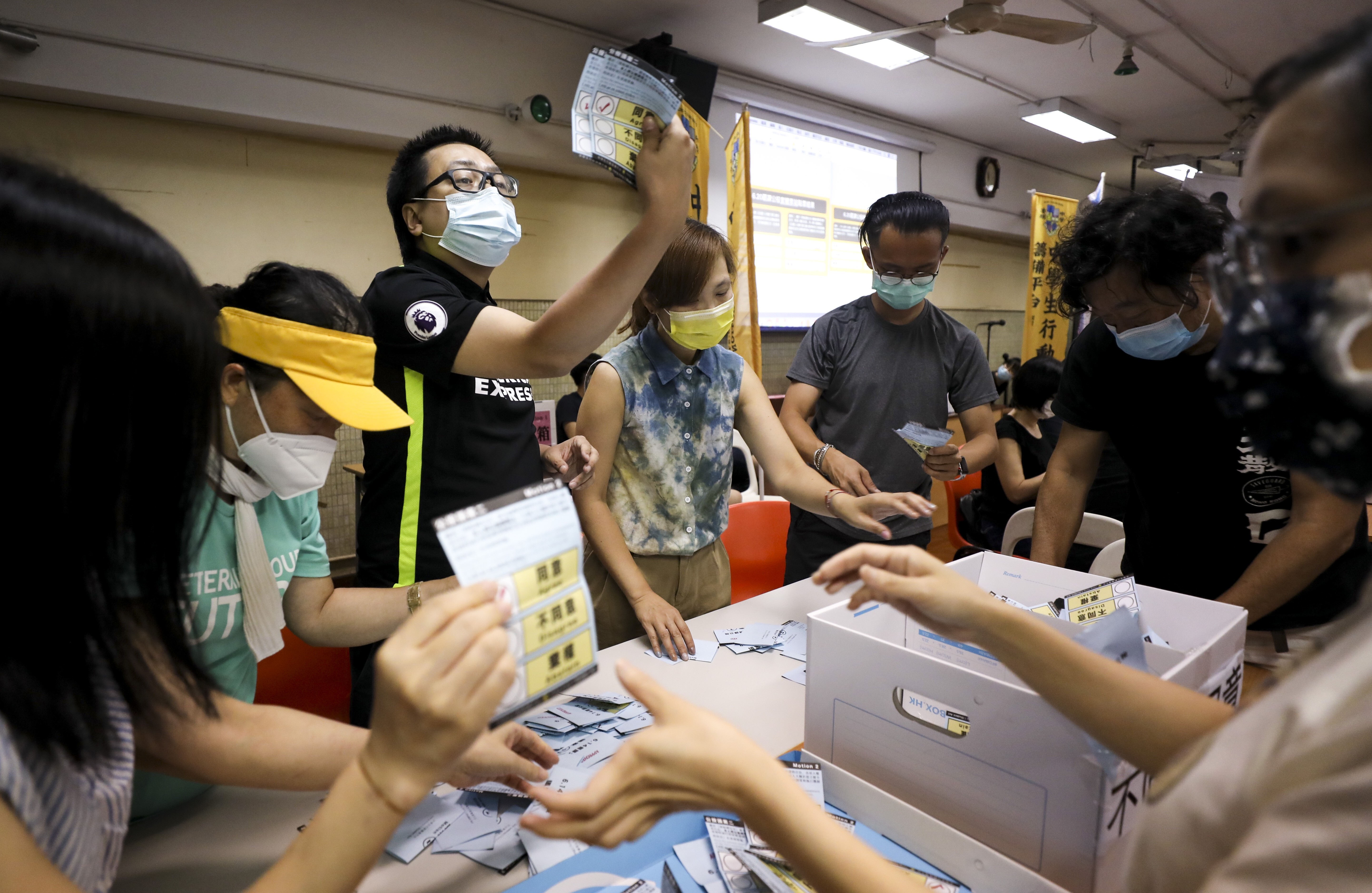 Volunteers count the ballots in Tsz Wan Shan after the poll closed at 9pm. Photo: Xiaomei Chen
