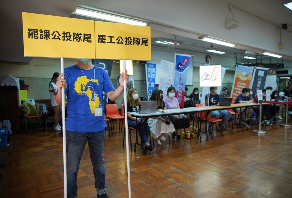 Polling station staff await voters in Tsz Wan Shan on Saturday morning. Photo: Winson Wong