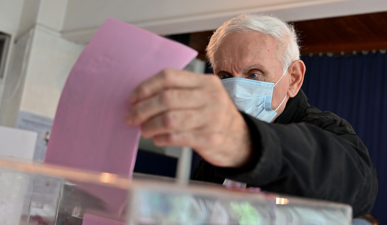 A man casts his ballot at a polling station in Belgrade on Sunday. Photo: AFP