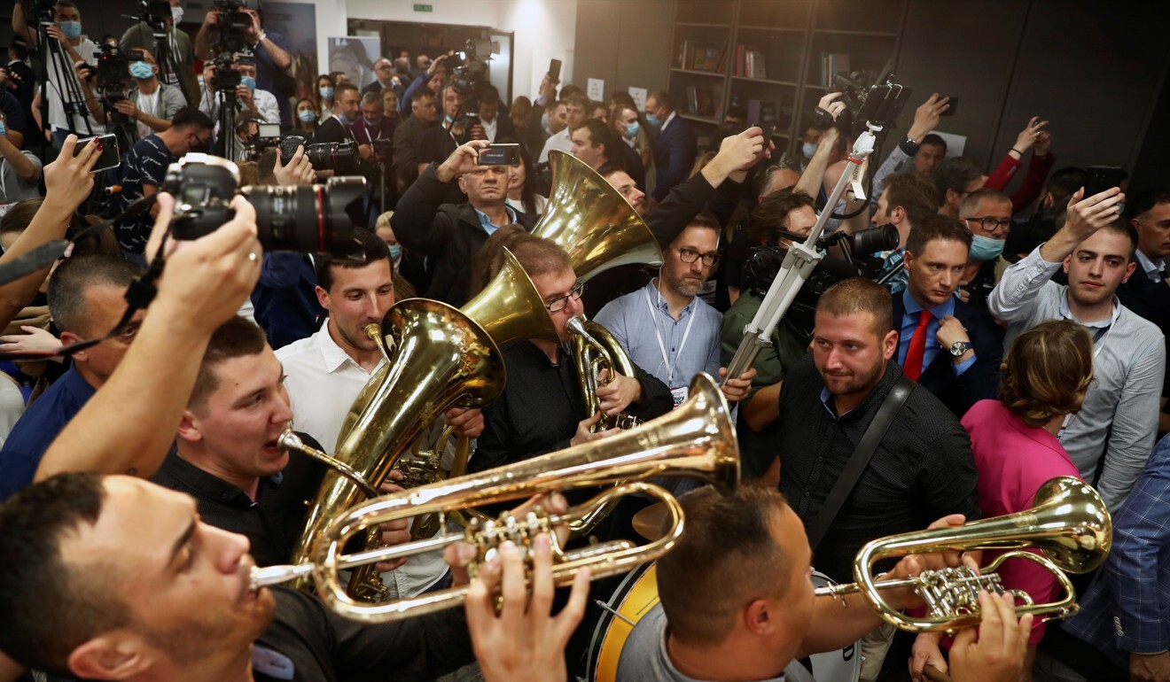 People play instruments at the Serbian Progressive Party headquarters in Belgrade during a national election on Sunday, the first in Europe since coronavirus lockdowns began. Photo: Reuters