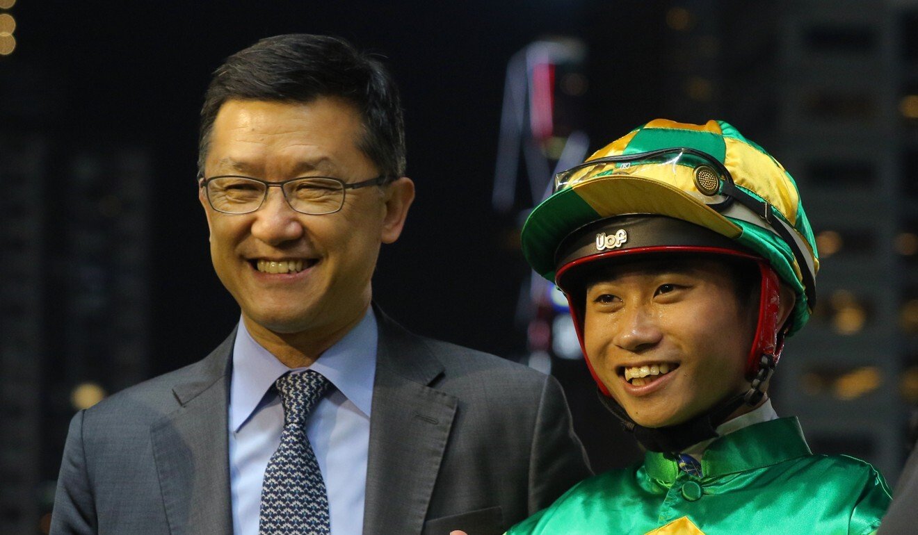 Trainer Peter Ho and jockey Dylan Mo celebrate a winner earlier this season.