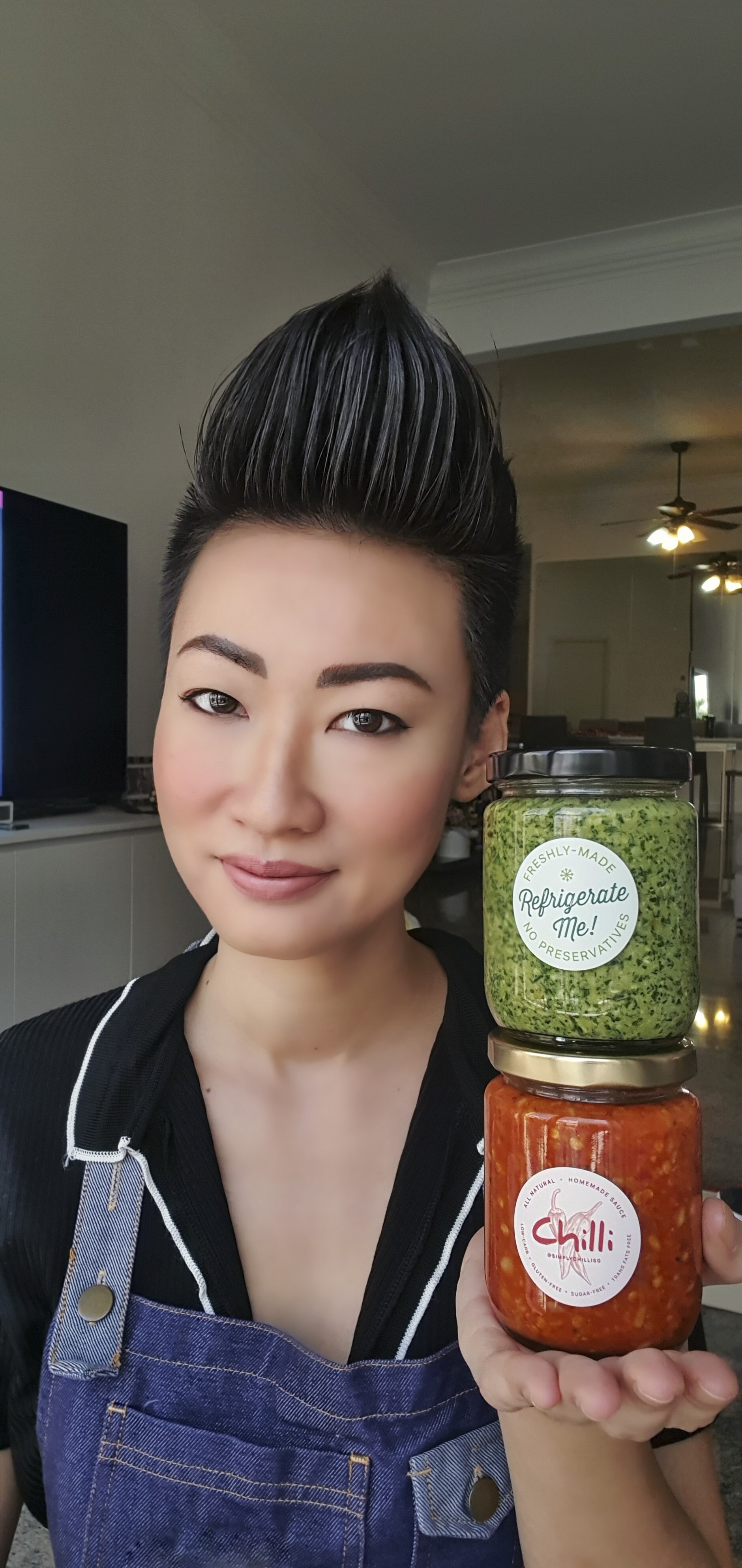 Esther Quek with jars of her chilli sauce and pesto.