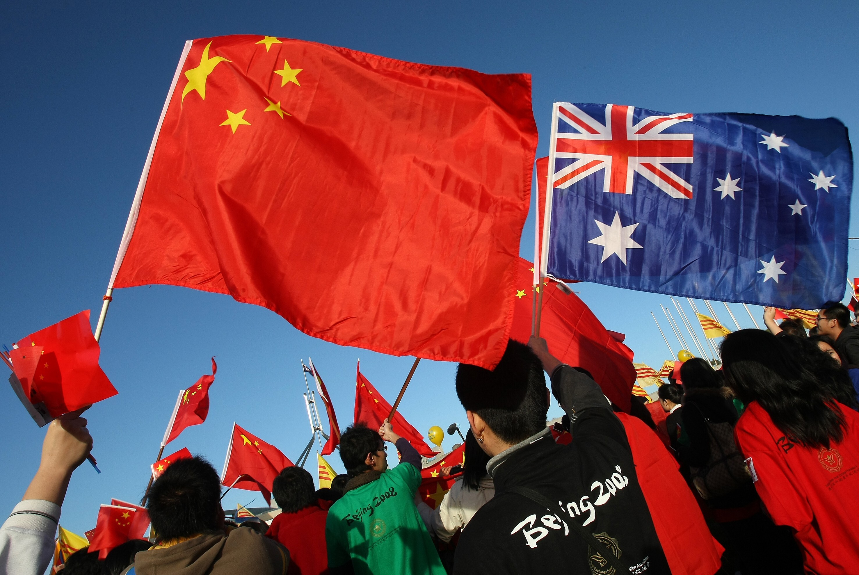 Chinese and Australian flags are seen in Canberra. There has been a sustained increase in anti-Chinese and more broadly anti-Asian racial abuse in Australia, especially after the coronavirus outbreak. Photo: AFP