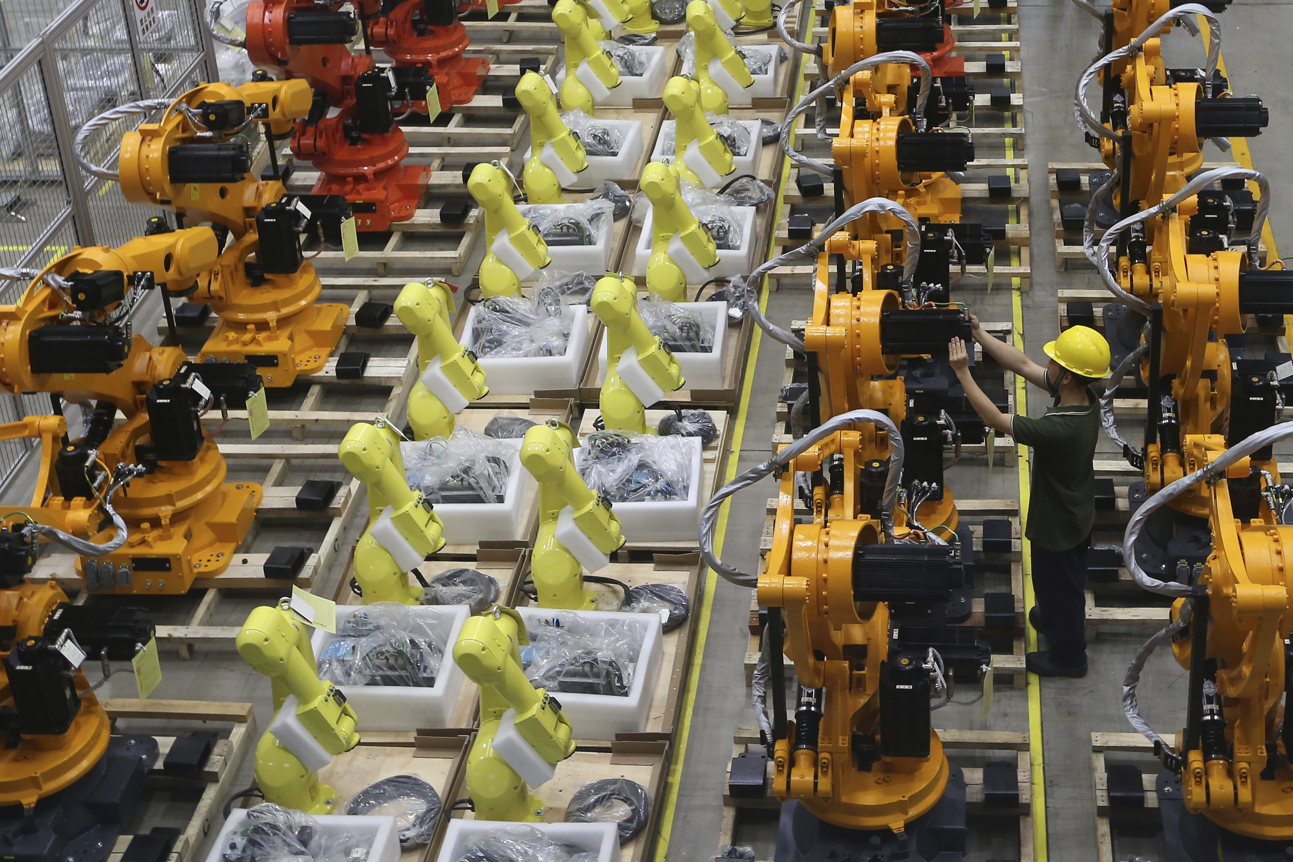 A worker checks on robot arms at a factory in Nanjing in east China’s Jiangsu province in June 2019. Both Chinese and British firms do not perform adequate due diligence. Photo: AP
