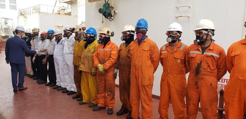 The crew of the Shandong Da Cheng, some of whom have been at sea for a year.