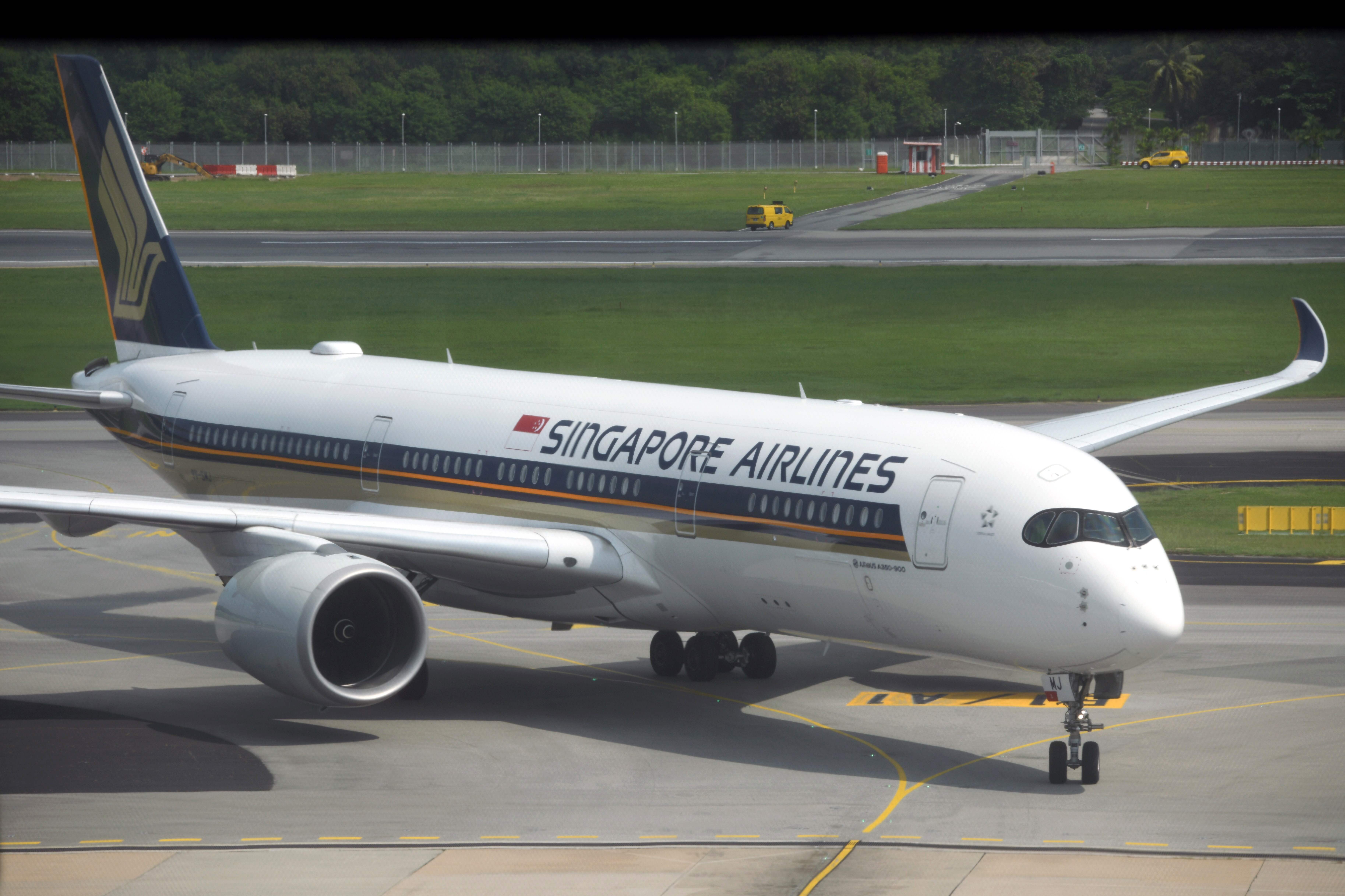 A Singapore Airlines passenger jet taxis along the tarmac as it arrives at Changi International Airport terminal in Singapore. Photo: AFP