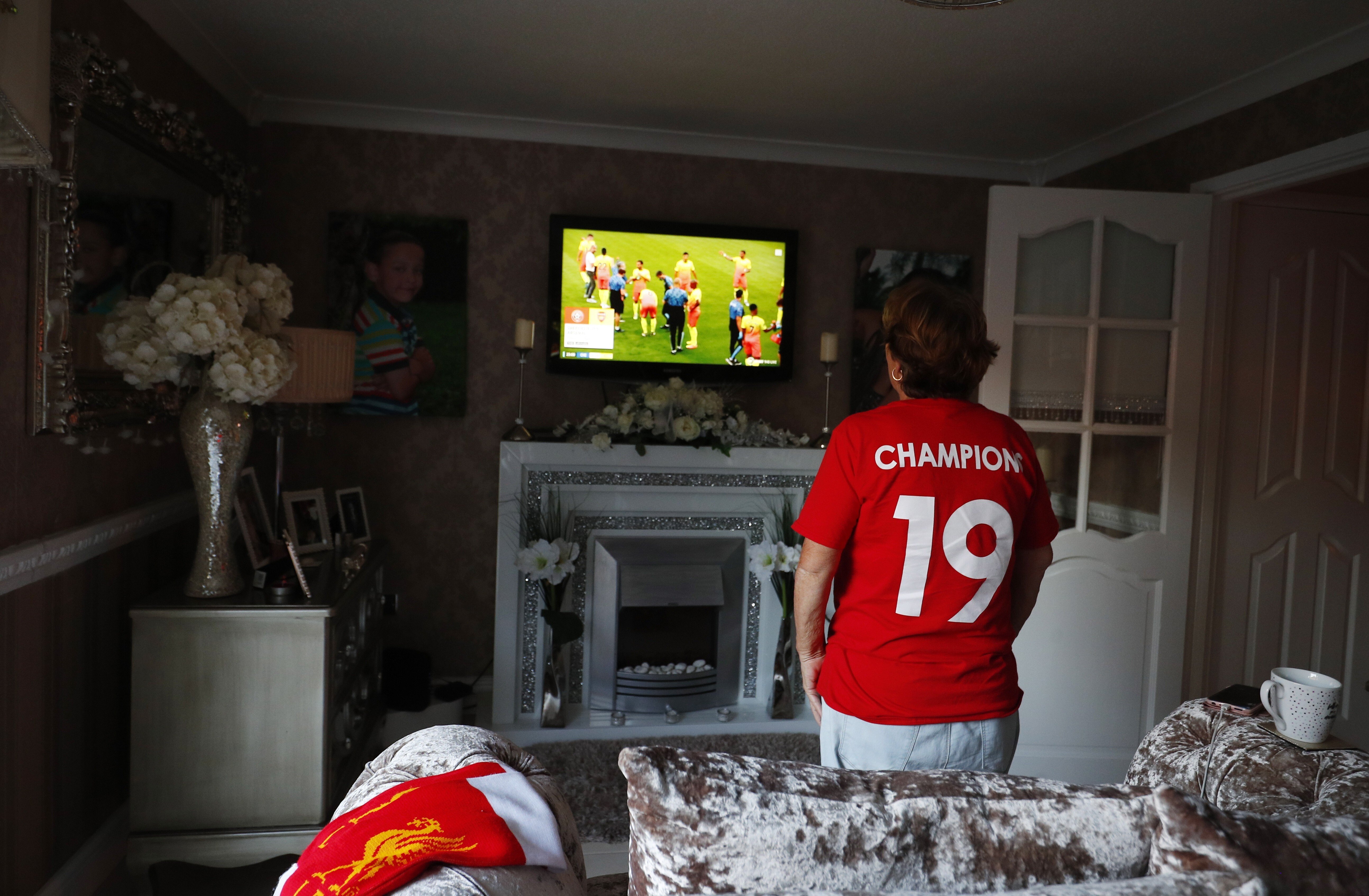 Most Liverpool supporters were forced to witness the club’s once in a generation title win from their own homes, but it’s no less special to them. Photo: EPA