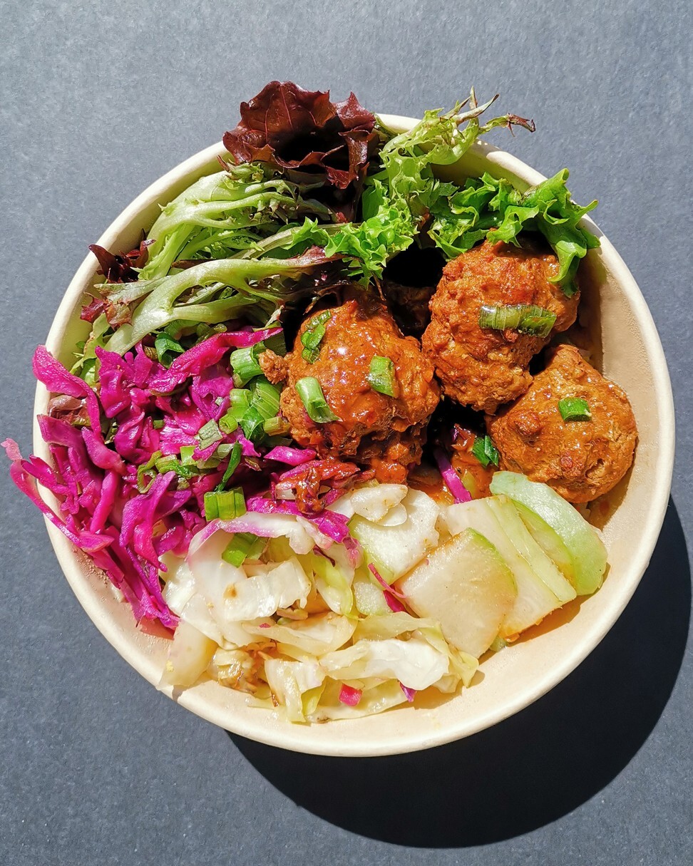 A lion’s head meatball millet rice bowl at Junzi. Photo: Kunning Huang