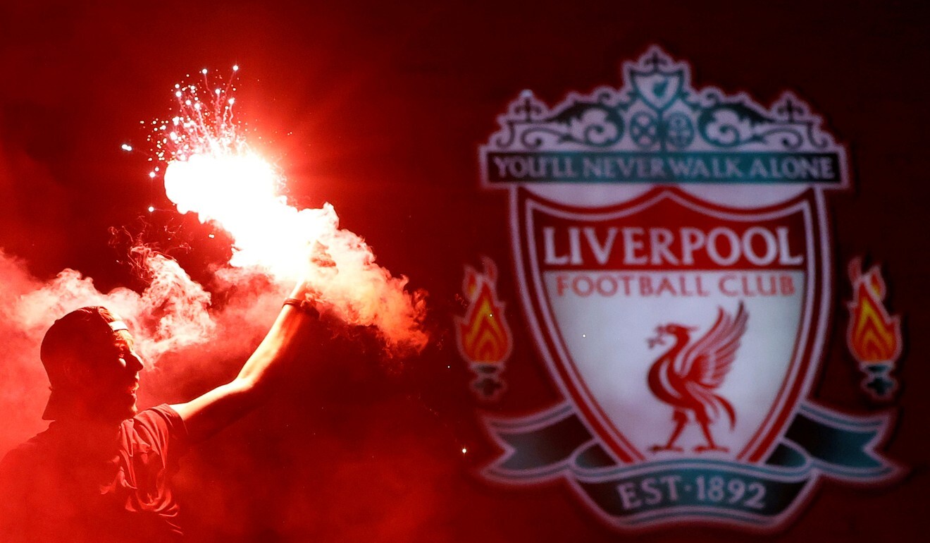 Liverpool supporters celebrate winning the Premier League outside Anfield. Photo: Reuters