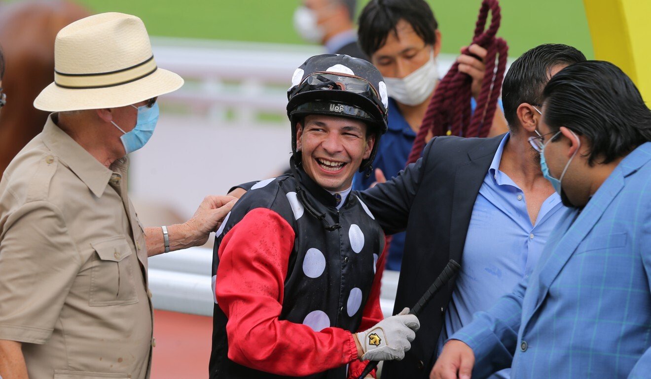 John Moore with jockey Vagner Borges after a win from Touch Of Luck.