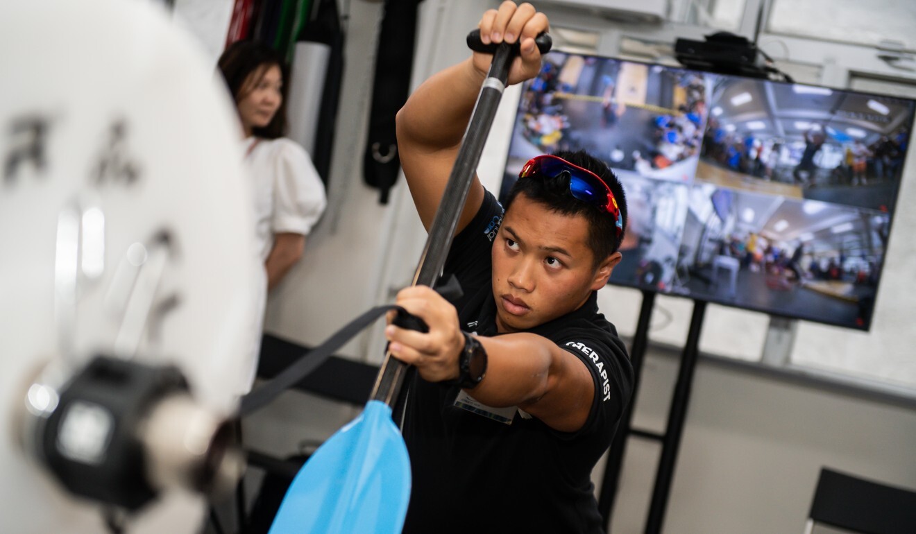 Roy Cheng demonstrates his technique on the dragon boat machine at Athletes Hub.