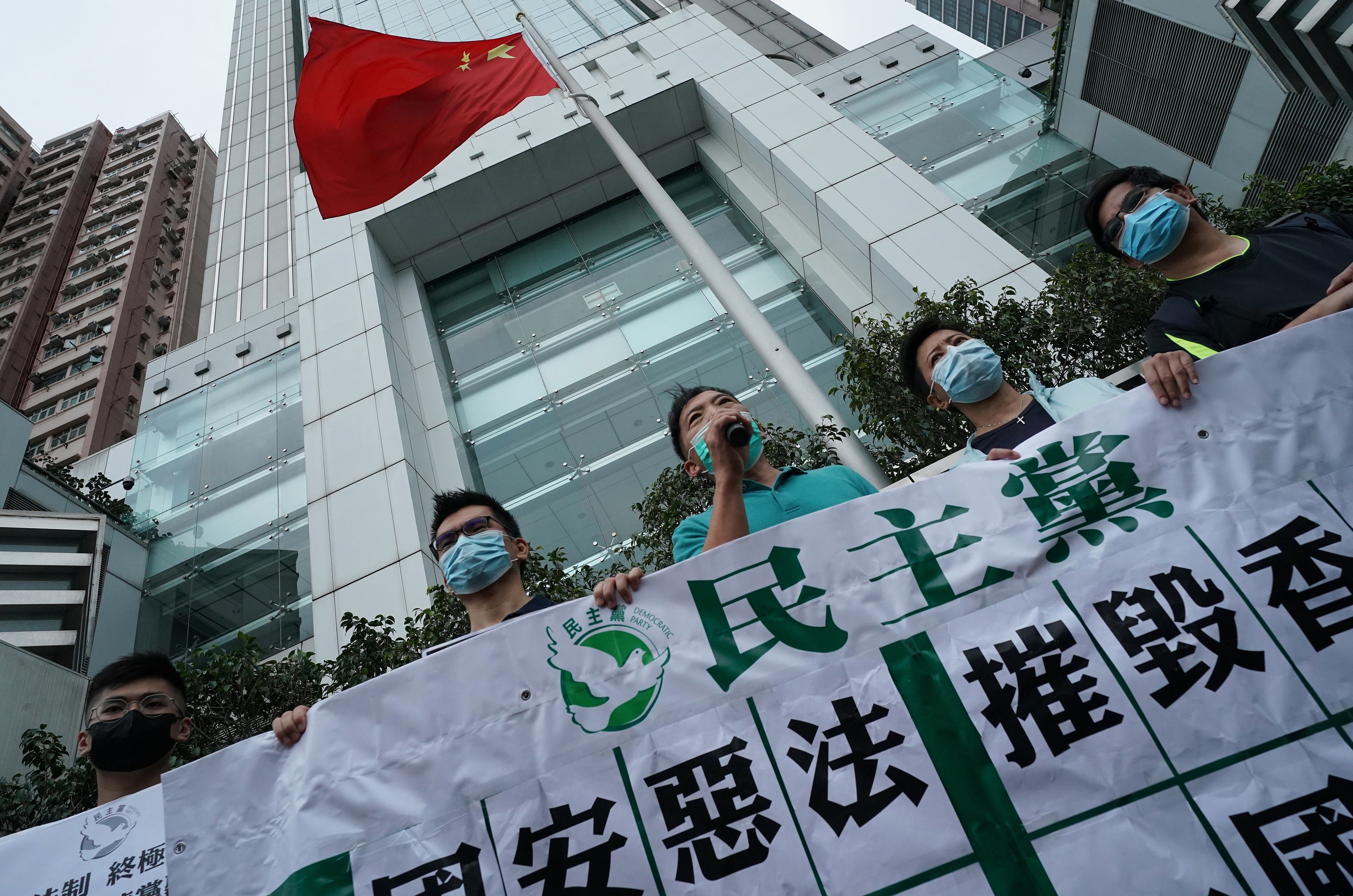 Pan-democrat lawmakers protest against a new national security law for Hong Kong, outside the central government’s liaison office in Sai Ying Pun on May 22. The law was unanimously passed by the National People’s Congress Standing Committee on June 30. Photo: Felix Wong