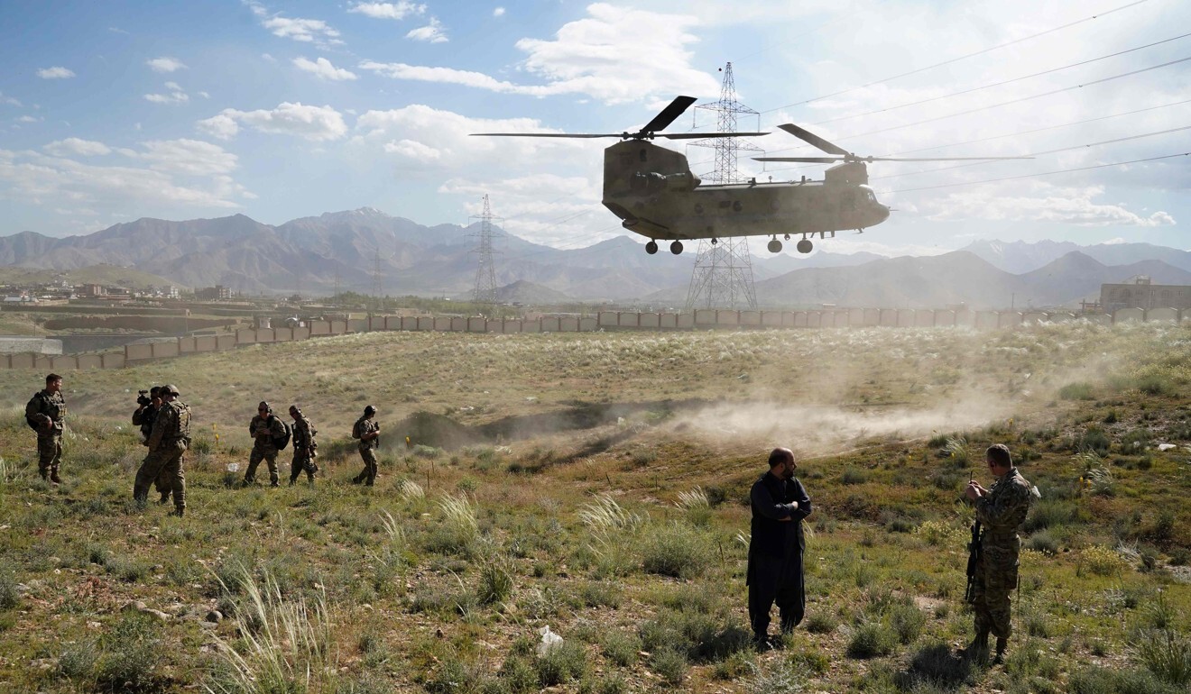 A US military Chinook helicopter lands on a field outside the governor's palace in Afghanistan in June 2019. Photo: AFP