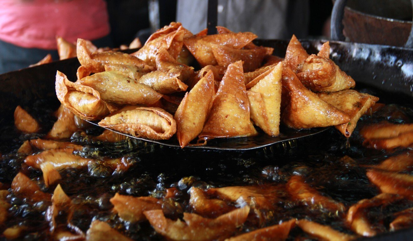 Hot and fresh samosas out of the pan in Russell Market, Bangalore. Photo: Getty Images