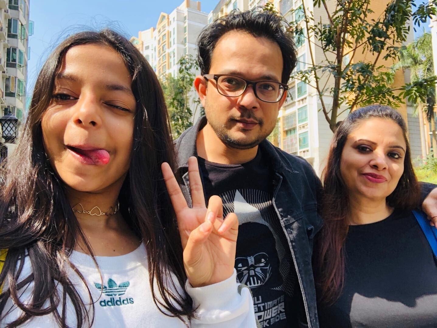 Mischka, Mehul and Dipika Kantharia (left to right) at their apartment complex in Shenzhen, China. Photo: Handout