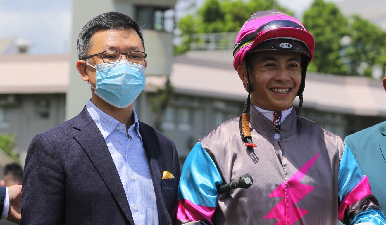 Trainer Peter Ho and jockey Derek Leung celebrate Hay Run’s victory.