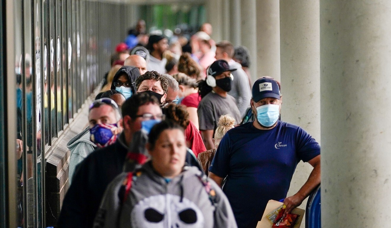 Hundreds of people line up outside a Kentucky Career Centre hoping to find assistance with their unemployment claims in Frankfort, on June 18. The US has added 7.5 million new jobs in the past two months. Photo: Reuters