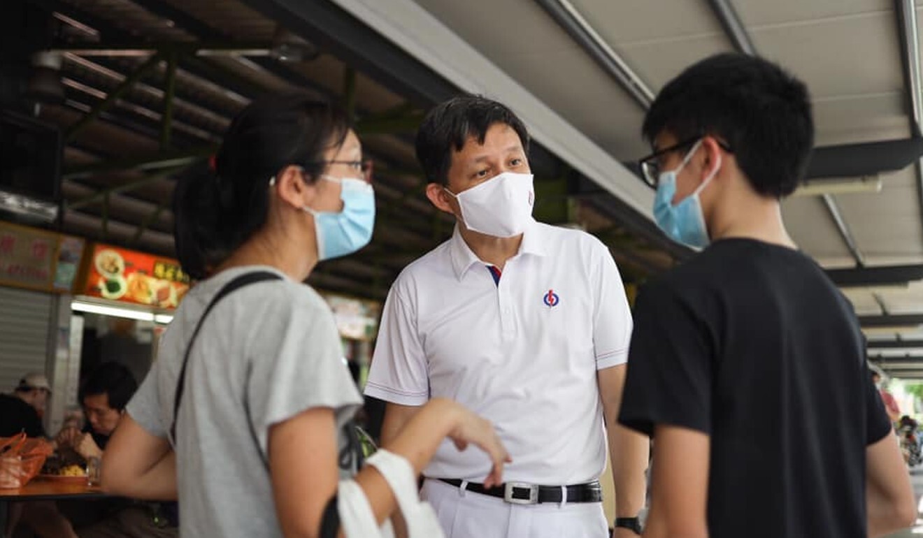 Chan Chun Sing from the People’s Action Party talks to residents on the campaign trail on July 6, 2020. Photo: Facebook