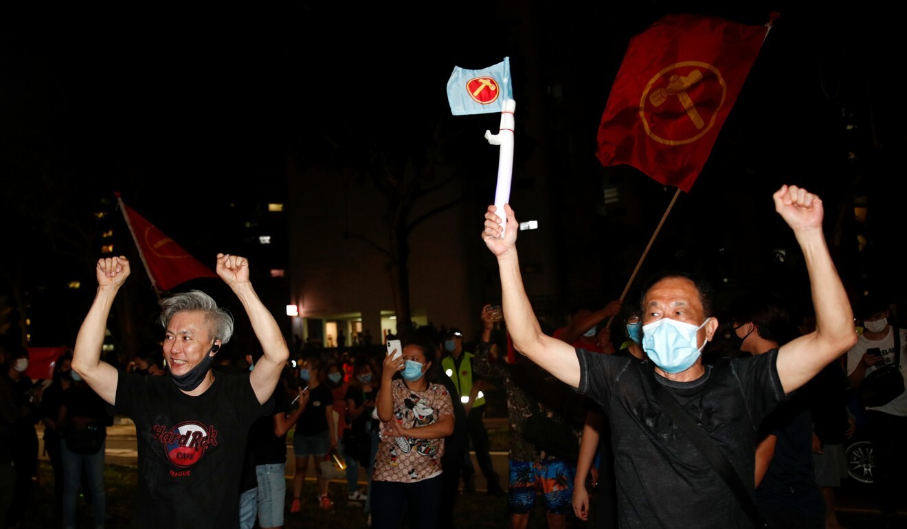 Workers’ Party supporters celebrate the results of the general election in Singapore on Saturday. Photo: Reuters