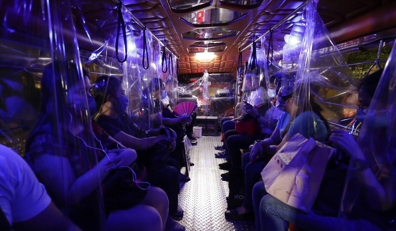 Plastic sheets on a traditional Jeepney bus separate passengers as part of health measures to help prevent the spread of the coronavirus in Manila, Philippines. Photo: AP