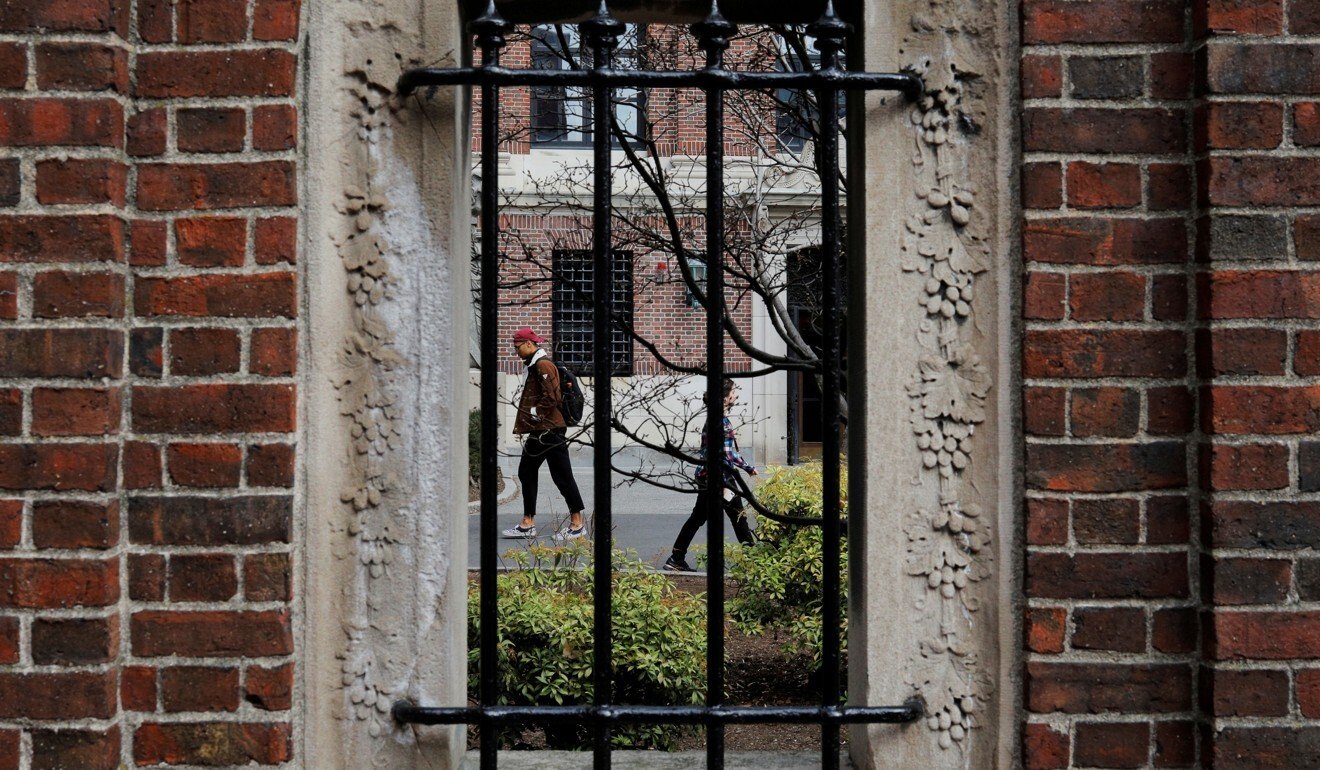 Students walk through Harvard Yard in Cambridge, Massachusetts, in March. Photo: Reuters