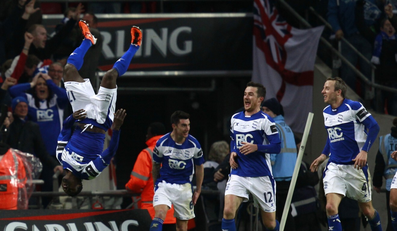 Birmingham City's Obafemi Martins (left) celebrates his goal against Arsenal during the 2011 English League Cup final. Photo: Reuters