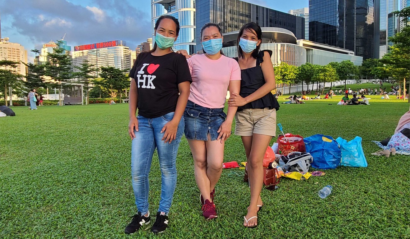 Lecnaj Ybañez Rolbmet (right), a Philippine domestic worker who publishes a vlog about her life, along with her friends in Hong Kong's Tamar Park. Photo: Masha Borak