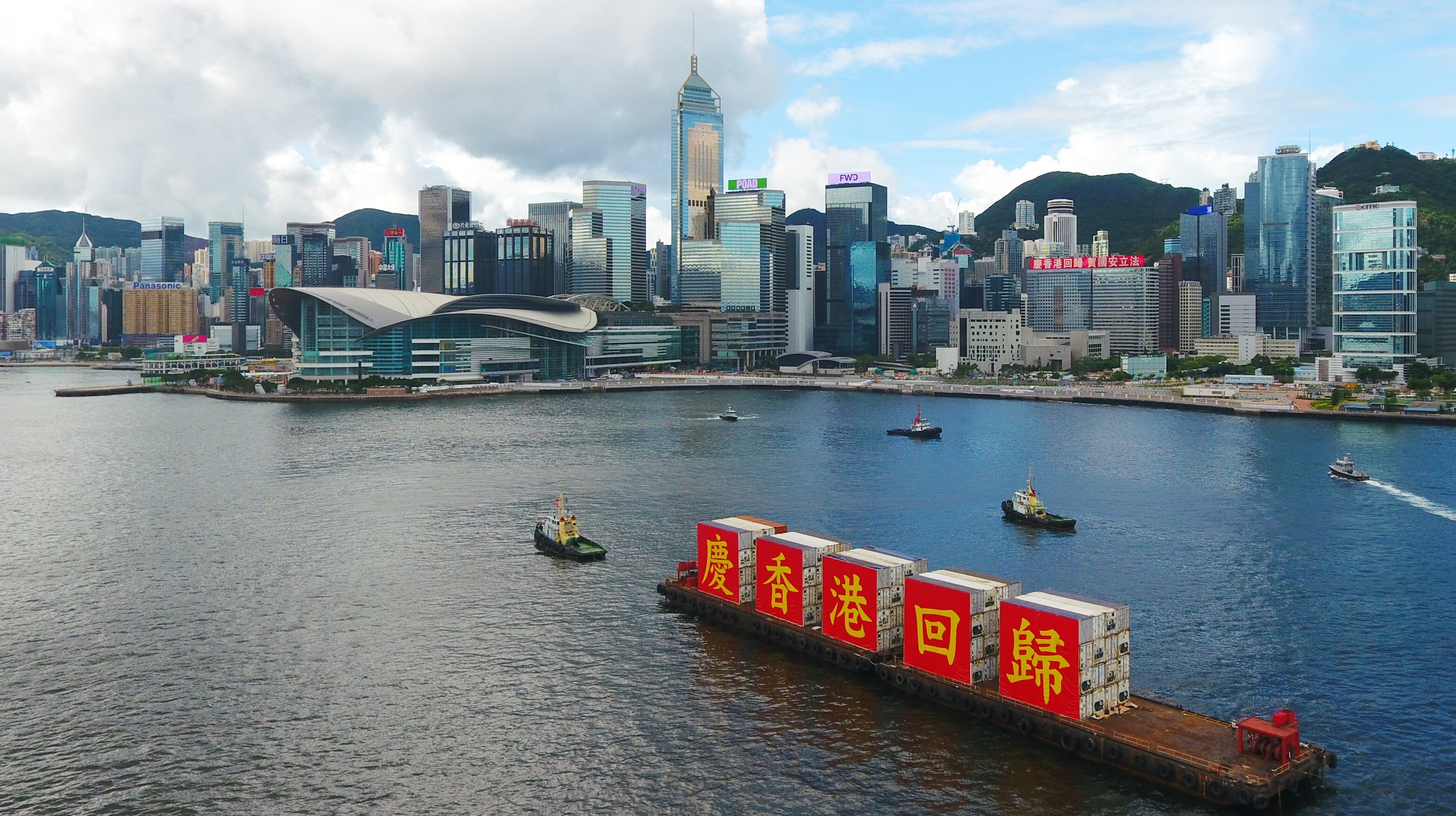 A barge bearing the slogan of “Celebrating the 23rd anniversary of Hong Kong’s return to the motherland” sails through Victoria Harbour in Hong Kong on July 1. Photo: Xinhua